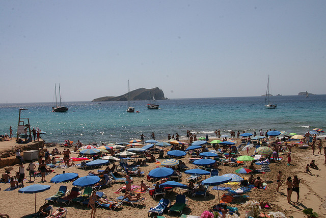 photo of people on the beach in Ibiza, Spain.
